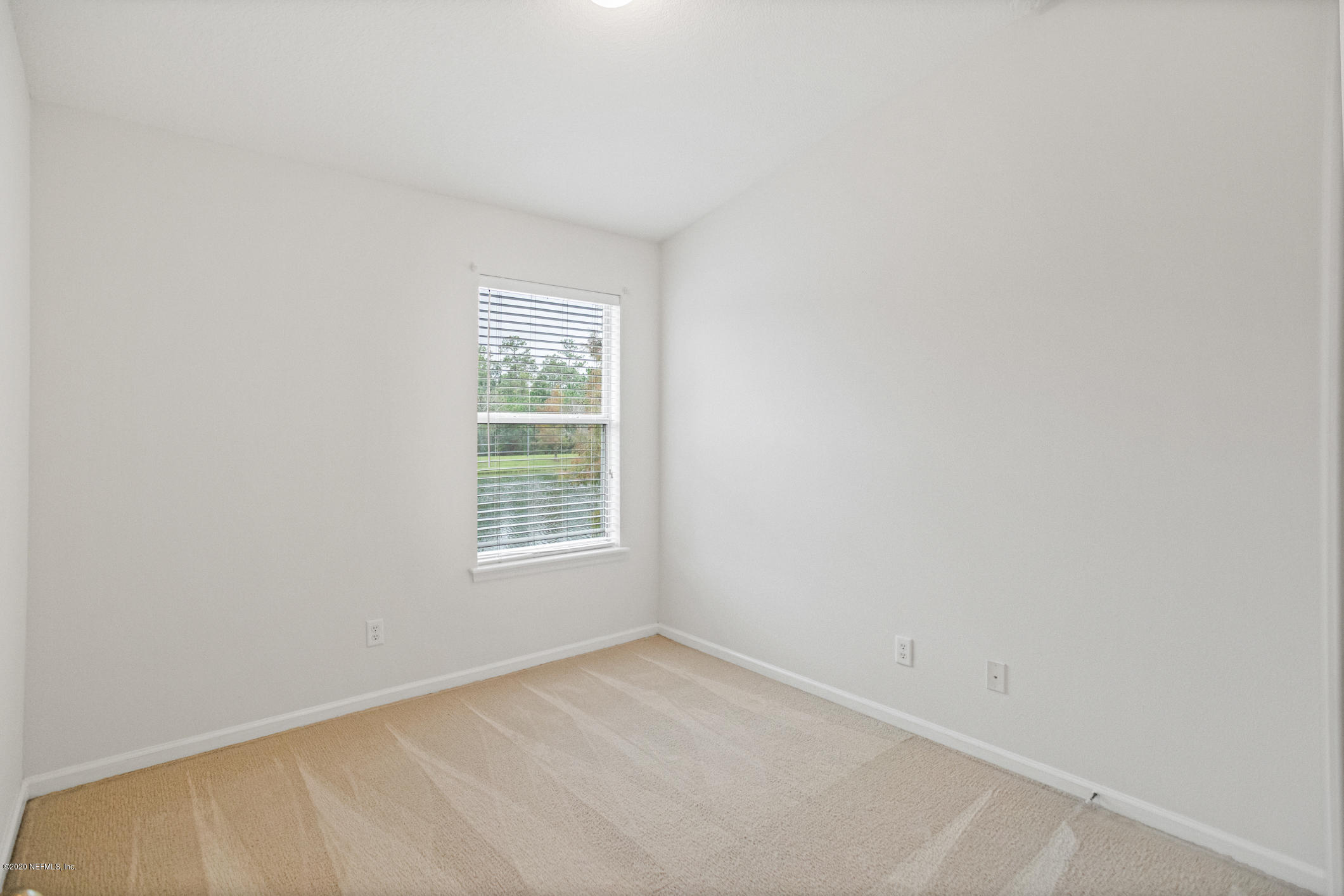 5784 Sandstone Way Jacksonville, FL 32258 - Photo 15 of 29 an empty room with a window