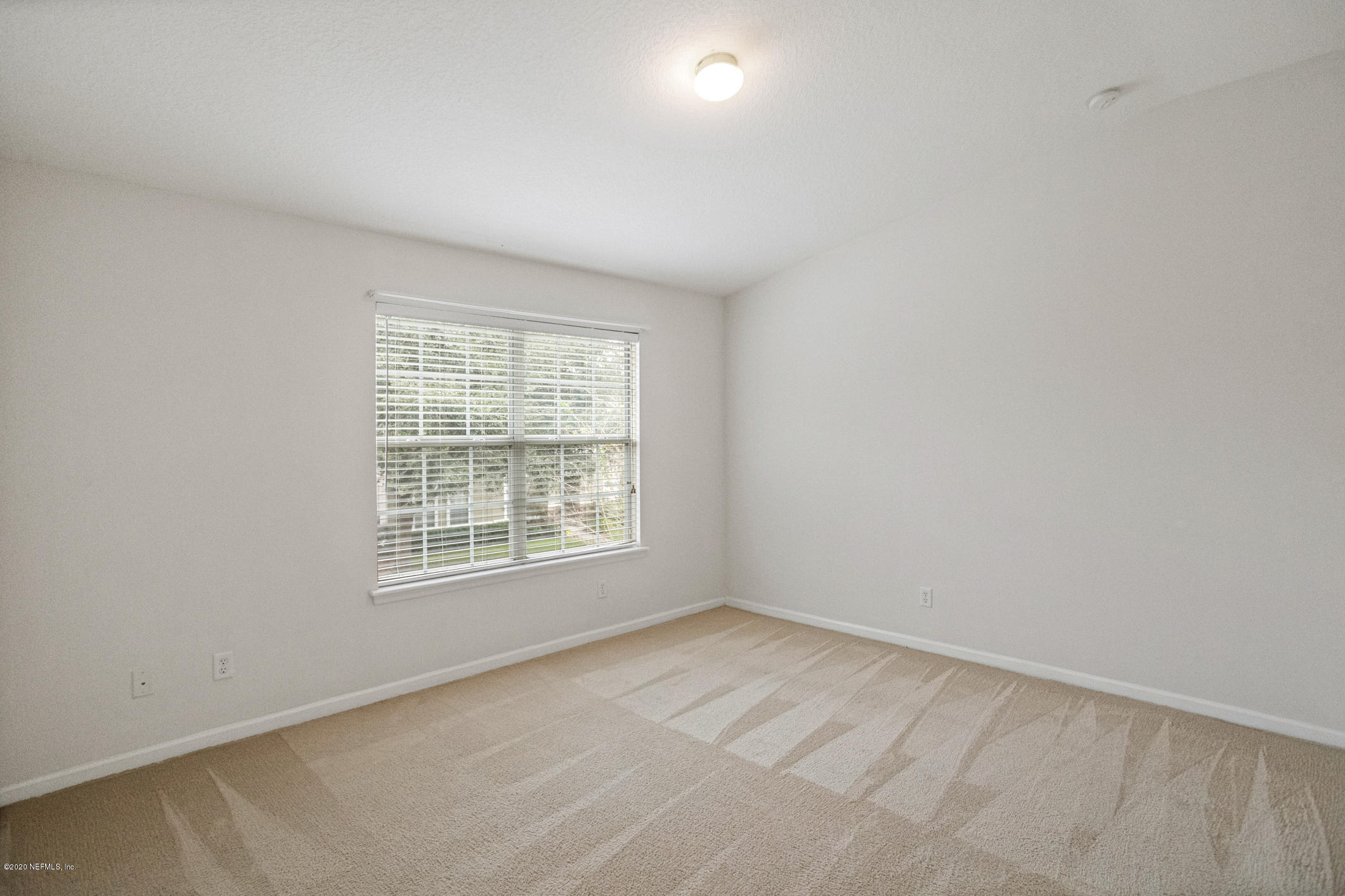 5784 Sandstone Way Jacksonville, FL 32258 - Photo 17 of 29 an empty room with a window