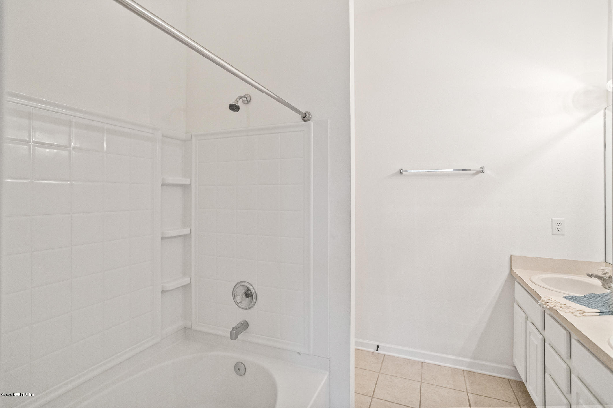 5784 Sandstone Way Jacksonville, FL 32258 - Photo 18 of 29 a bathroom with a tub a sink and a shower