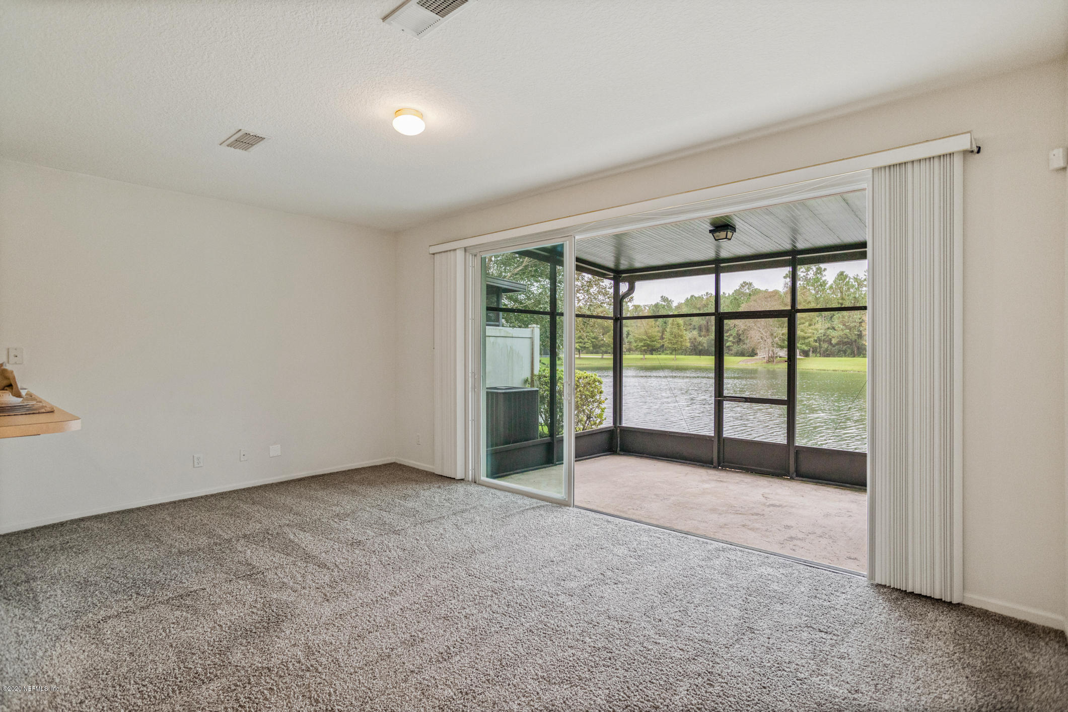 5784 Sandstone Way Jacksonville, FL 32258 - Photo 6 of 29 a view of an empty room with a window