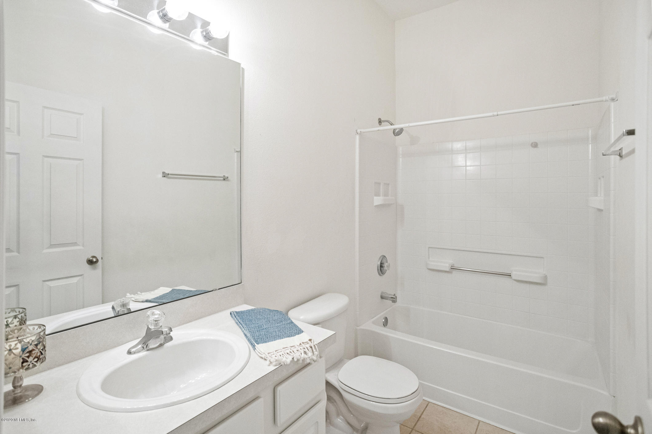5784 Sandstone Way Jacksonville, FL 32258 - Photo 10 of 29 a bathroom with a sink toilet and shower