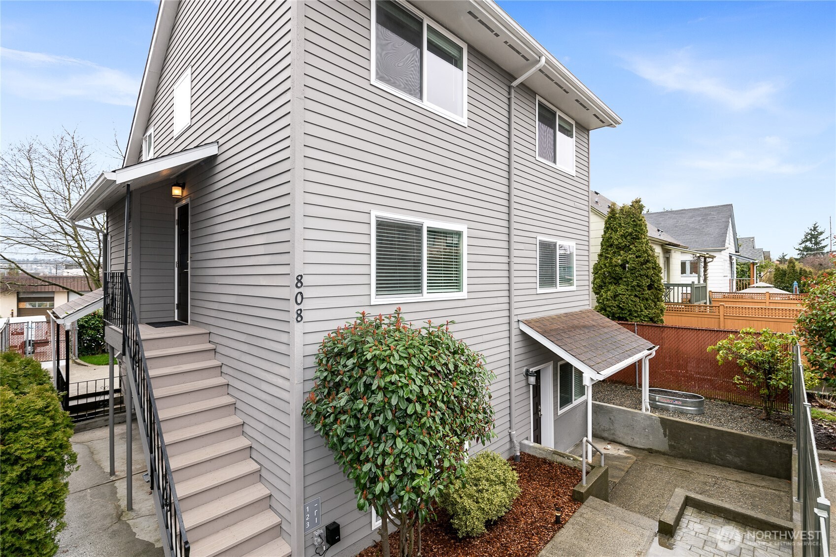 808 Northwest Market Street Seattle, WA 98107 - Photo 2 of 18 a view of a house with a yard and sitting area