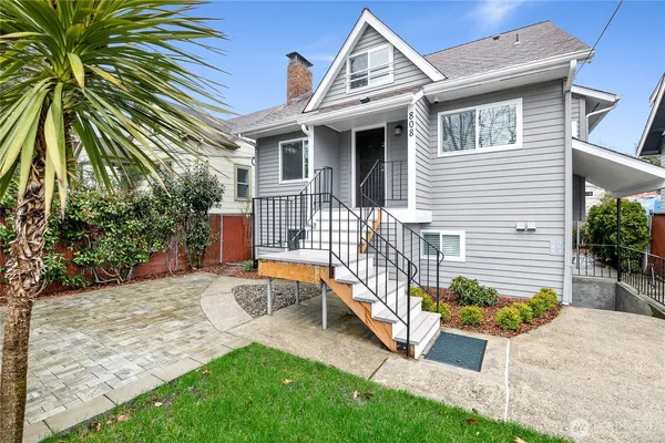 a front view of a house with garden