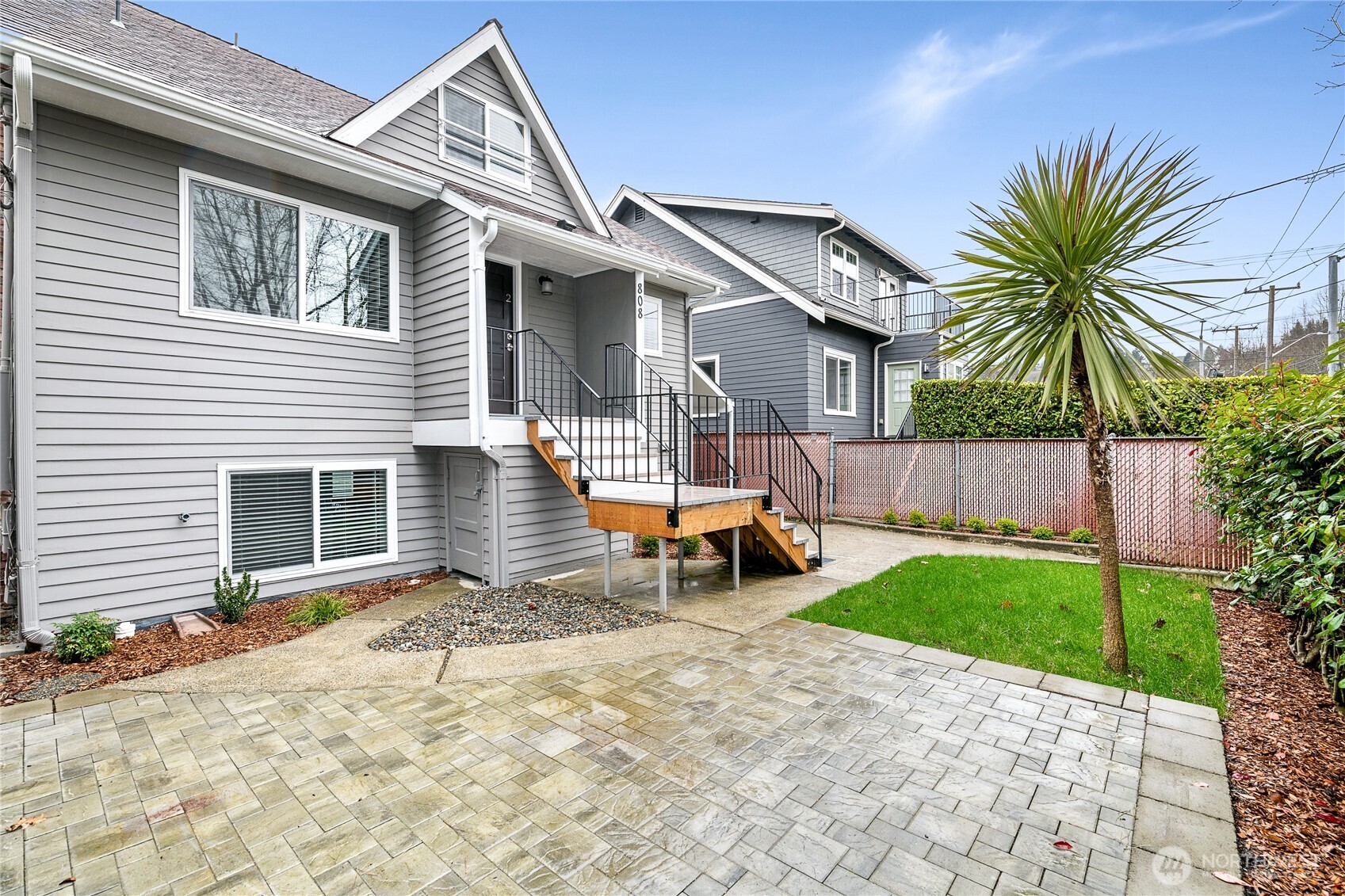 808 Northwest Market Street Seattle, WA 98107 - Photo 5 of 18 a view of a house with backyard and a tree