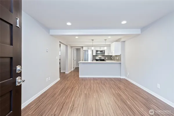 a view of kitchen with wooden floor
