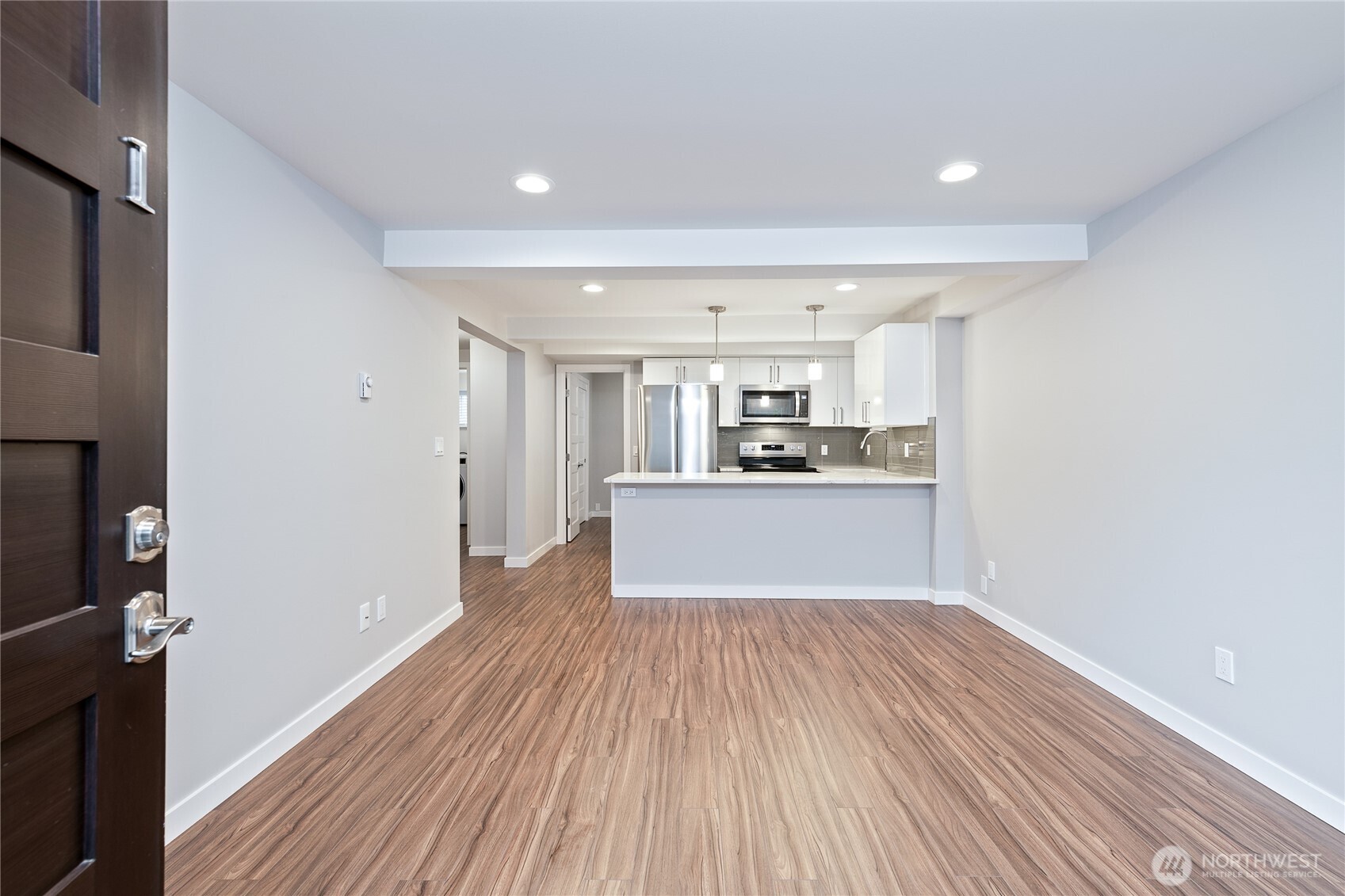 808 Northwest Market Street Seattle, WA 98107 - Photo 6 of 18 a view of kitchen with wooden floor