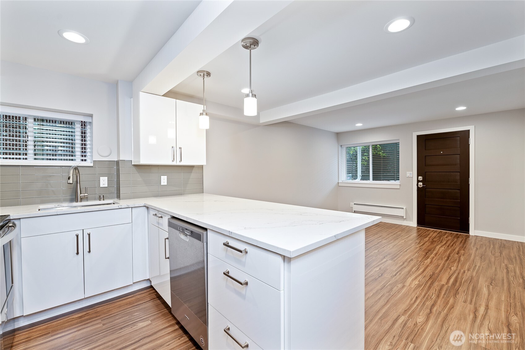 808 Northwest Market Street Seattle, WA 98107 - Photo 7 of 18 a kitchen with a wooden floor and window