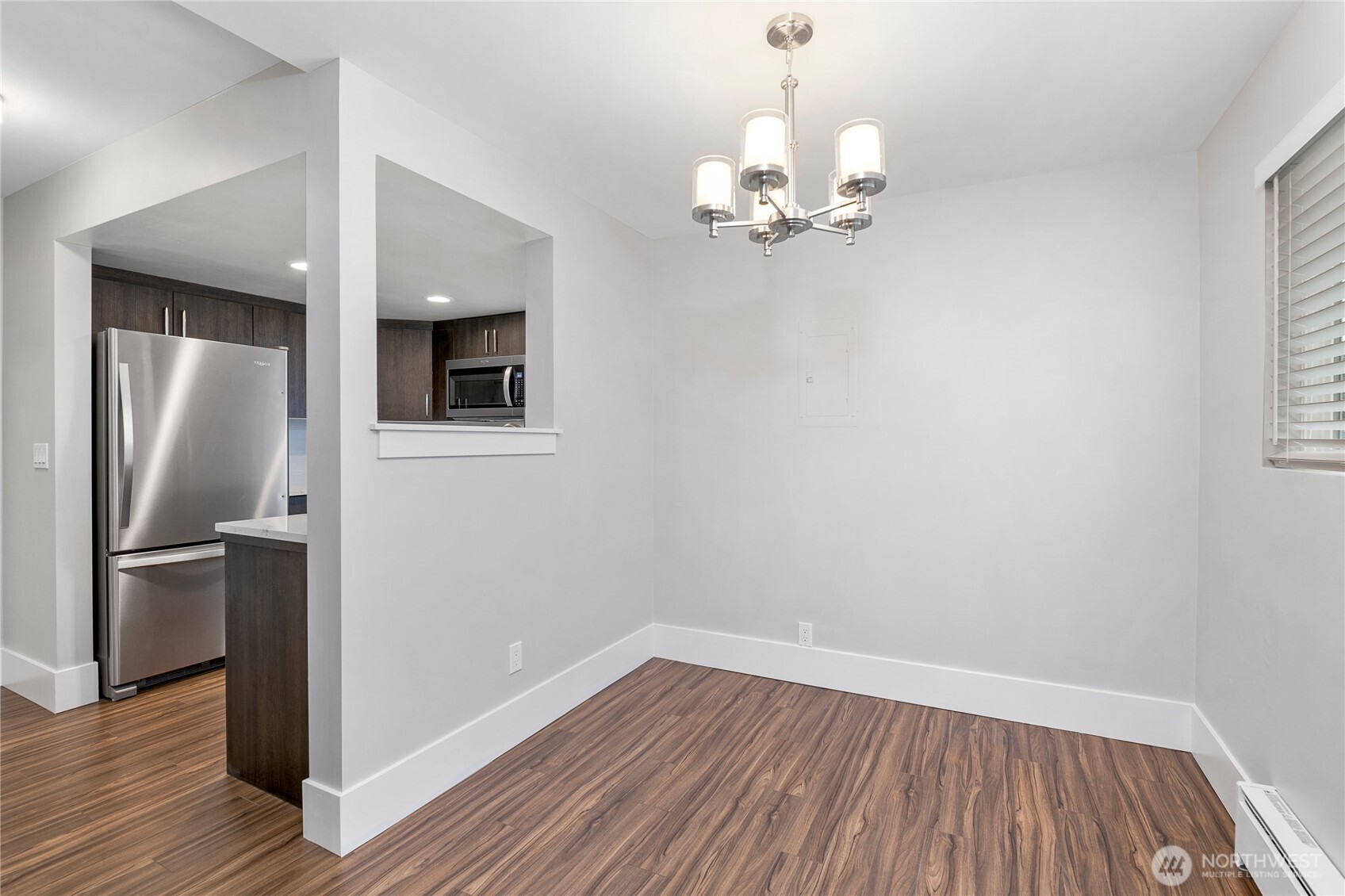 808 Northwest Market Street Seattle, WA 98107 - Photo 10 of 18 wooden floor in an empty room with a window