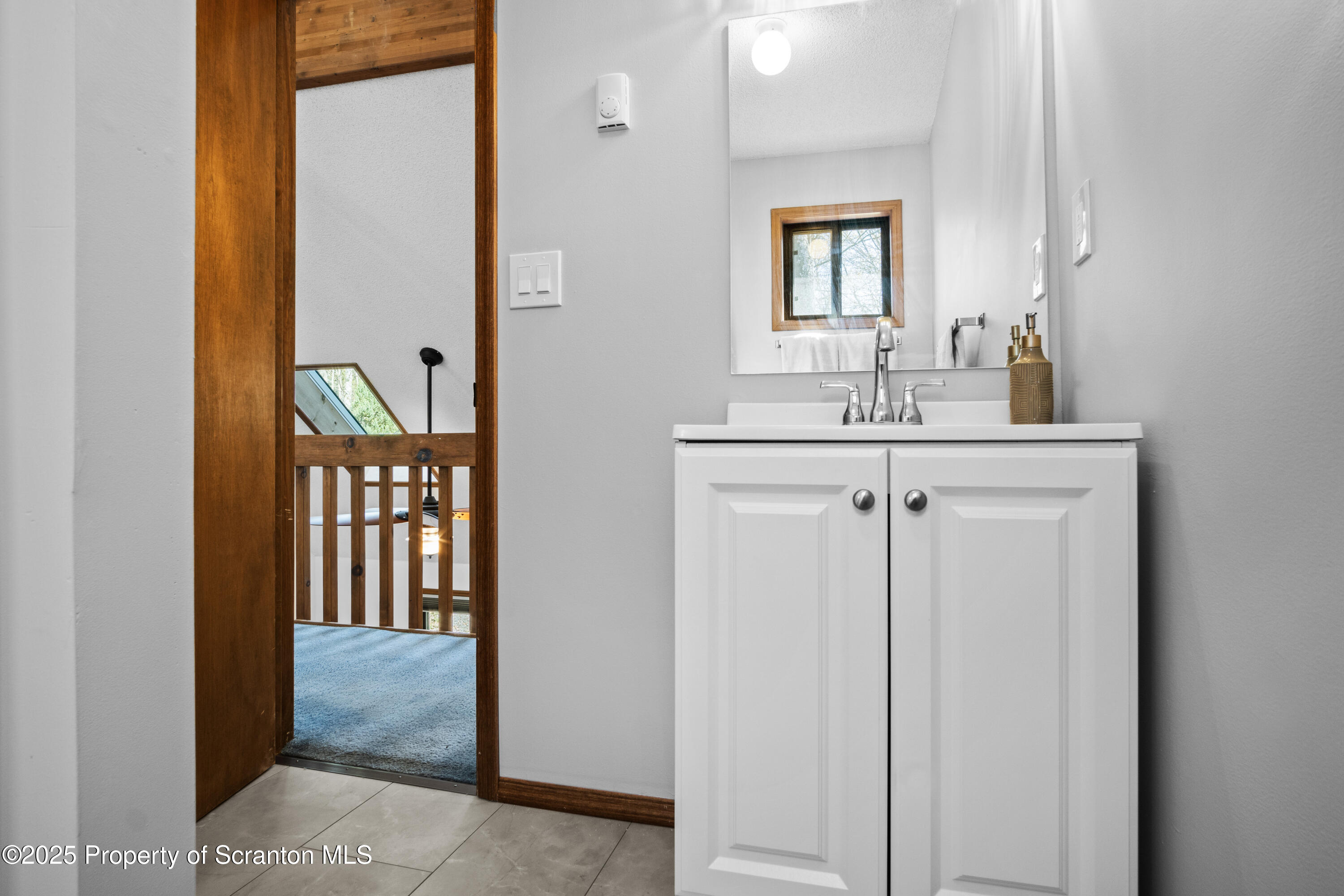41 Crest View Road Lake Ariel, PA 18436 - Photo 24 of 54 a bathroom with a sink and a mirror