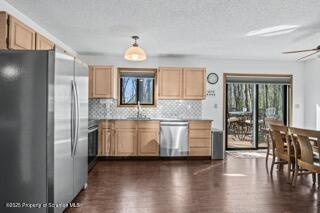 41 Crest View Road Lake Ariel, PA 18436 - Photo 54 of 54 a kitchen with stainless steel appliances granite countertop a refrigerator a stove and a wooden cabinets with wooden floor