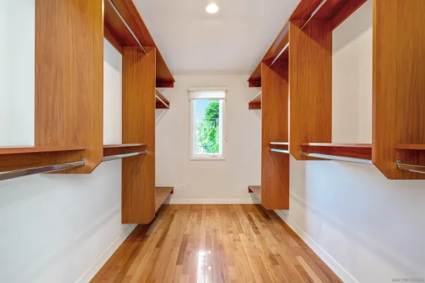 a view of a room with wooden floor and staircase