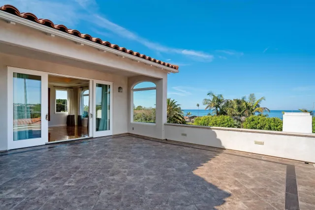 front view of a house with a large window