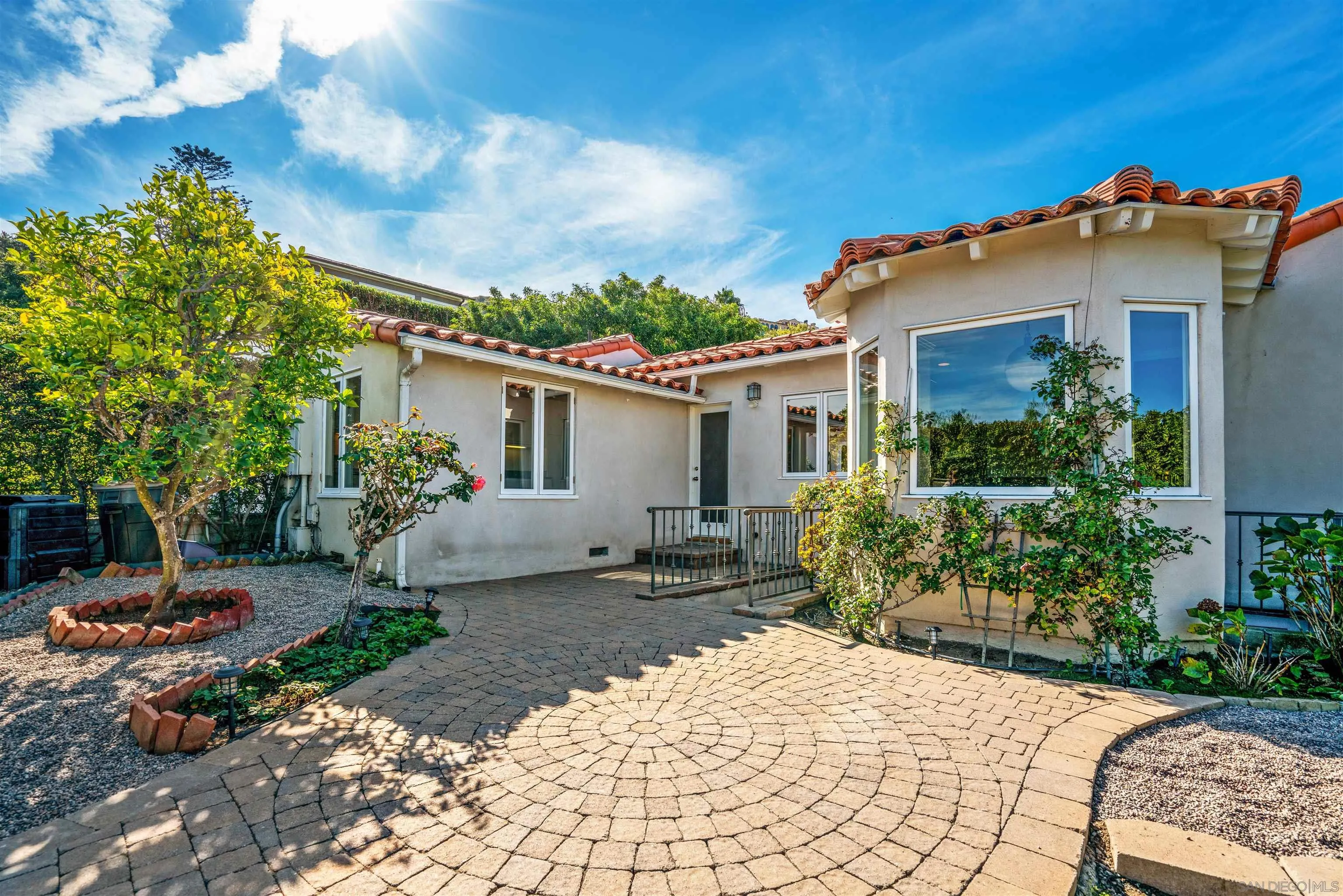 1865 Soledad Avenue La Jolla, CA 92037 - Photo 2 of 32 a view of a patio with a table and chairs and potted plants