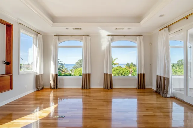 a view of an entryway with wooden floor