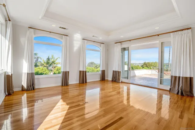 a view of an entryway with wooden floor and windows