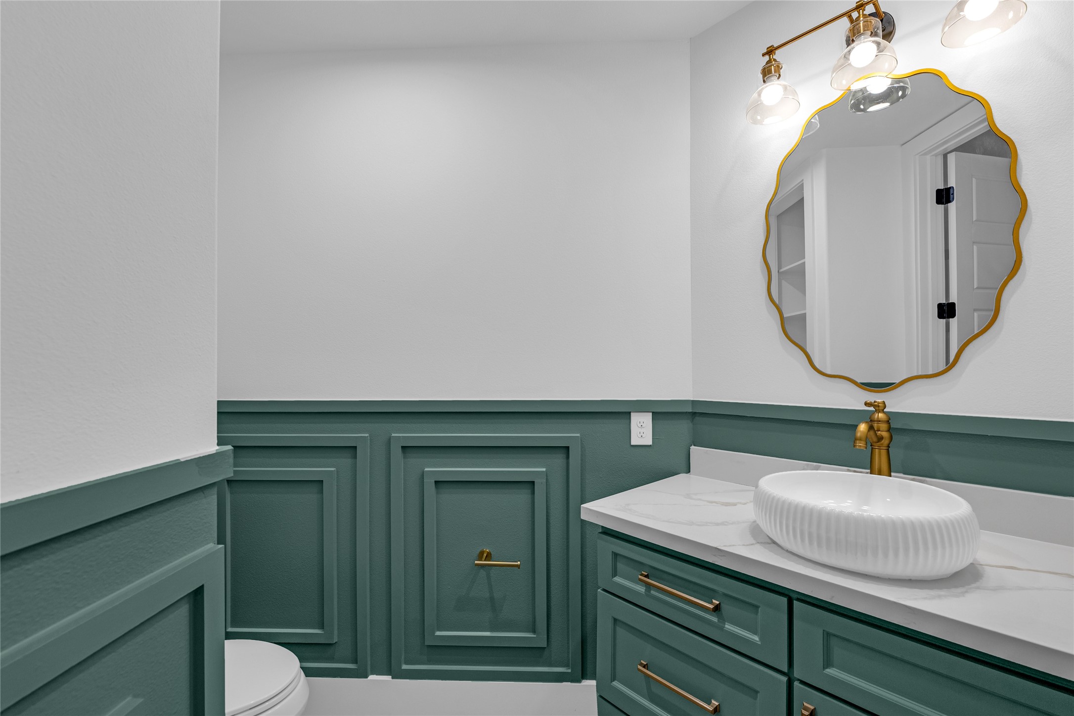 2031 Peppermill Road Houston, TX 77080 - Photo 19 of 48 The downstairs half bath blends vintage style with practical design. This home has personality you won’t find in a cookie-cutter build.