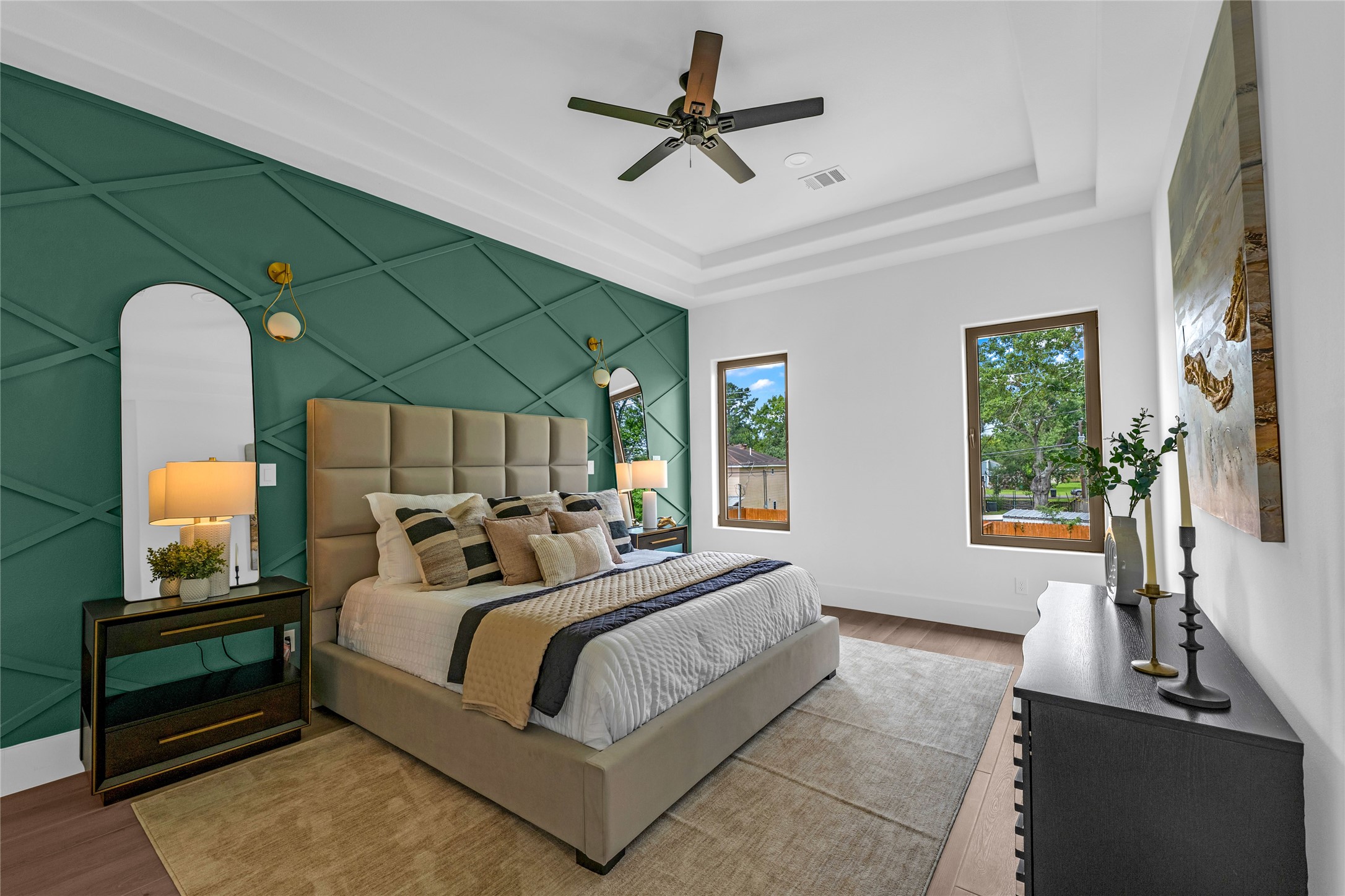 2031 Peppermill Road Houston, TX 77080 - Photo 22 of 48 Step into the owner’s oasis, where an elegant feature wall, stylish sconces, and backyard-facing windows create a serene retreat.