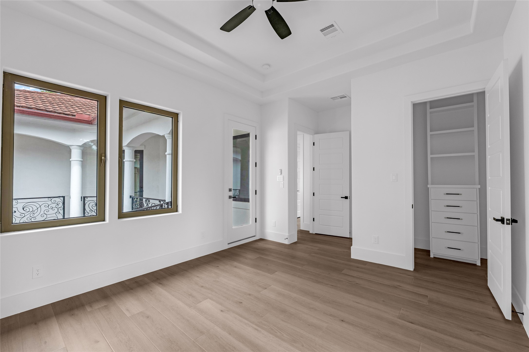 2031 Peppermill Road Houston, TX 77080 - Photo 32 of 48 Bedroom 3 with access to the wrap-around balcony overlooking the courtyard. All bedroom closets have built-in dressers, shelves and rods