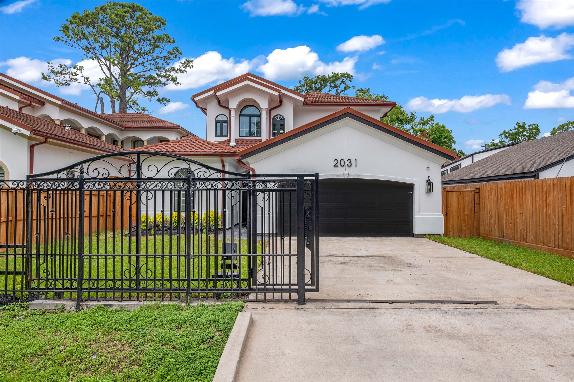 2031 Peppermill Road Houston, TX 77080 - Photo 43 of 48 The wrought iron gate, featuring remote access, is a rare amenity in the area that enhances both privacy and security.