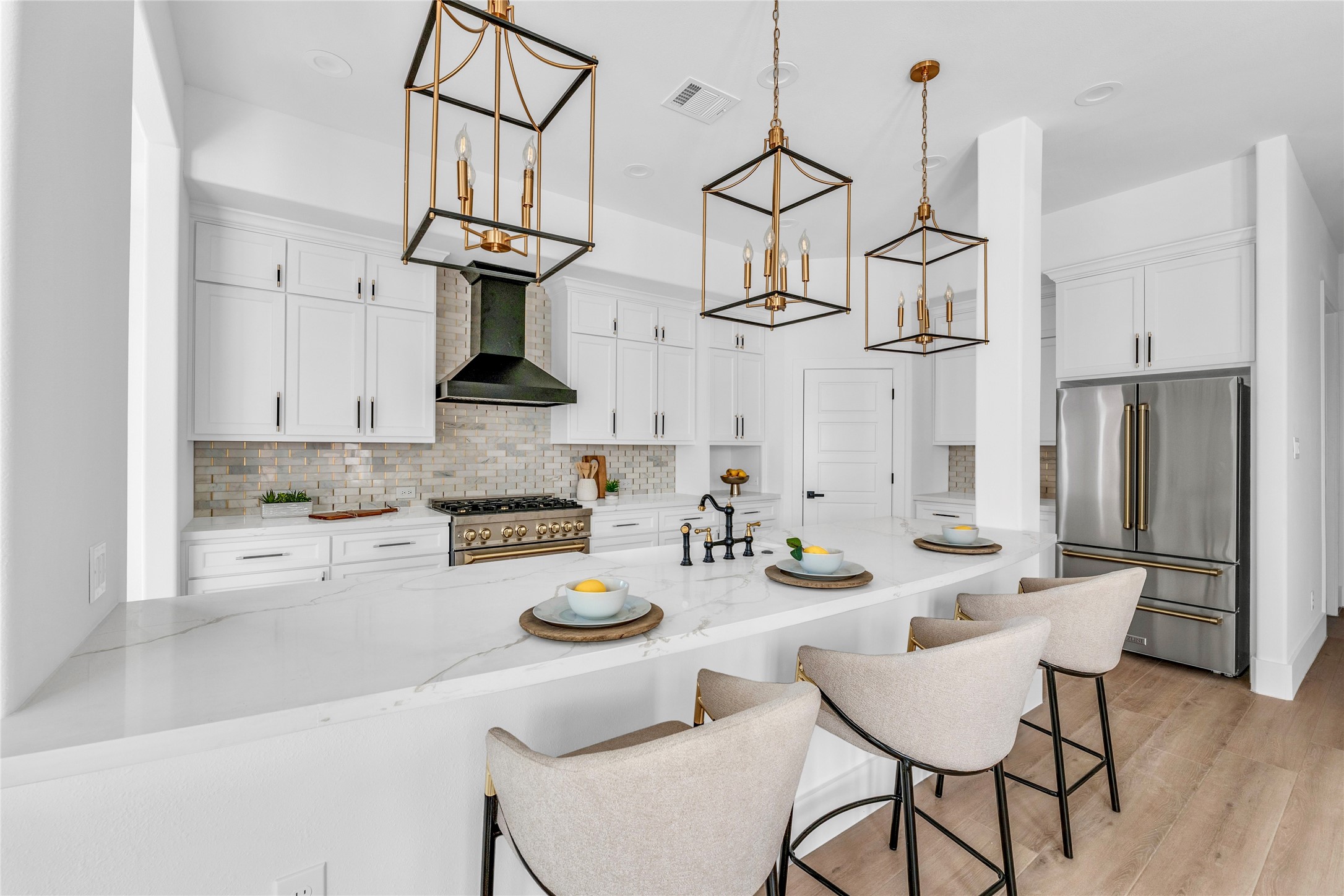 2031 Peppermill Road Houston, TX 77080 - Photo 5 of 48 The kitchen impresses with quartz countertops, an expansive 11-foot island, and high-end designer touches.