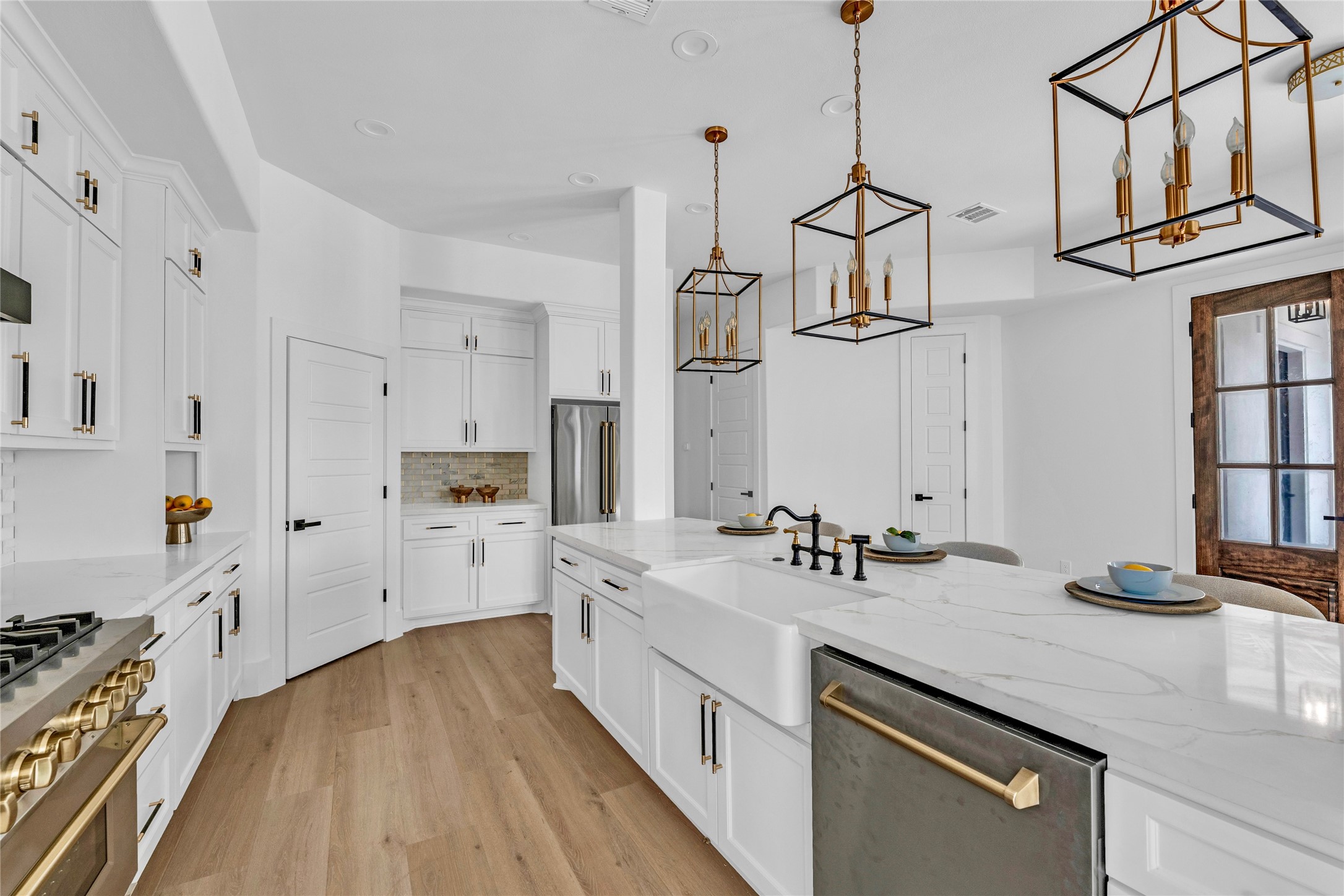 2031 Peppermill Road Houston, TX 77080 - Photo 8 of 48 The two-toned bridge faucet pairs beautifully with the classic fireclay apron-front sink.