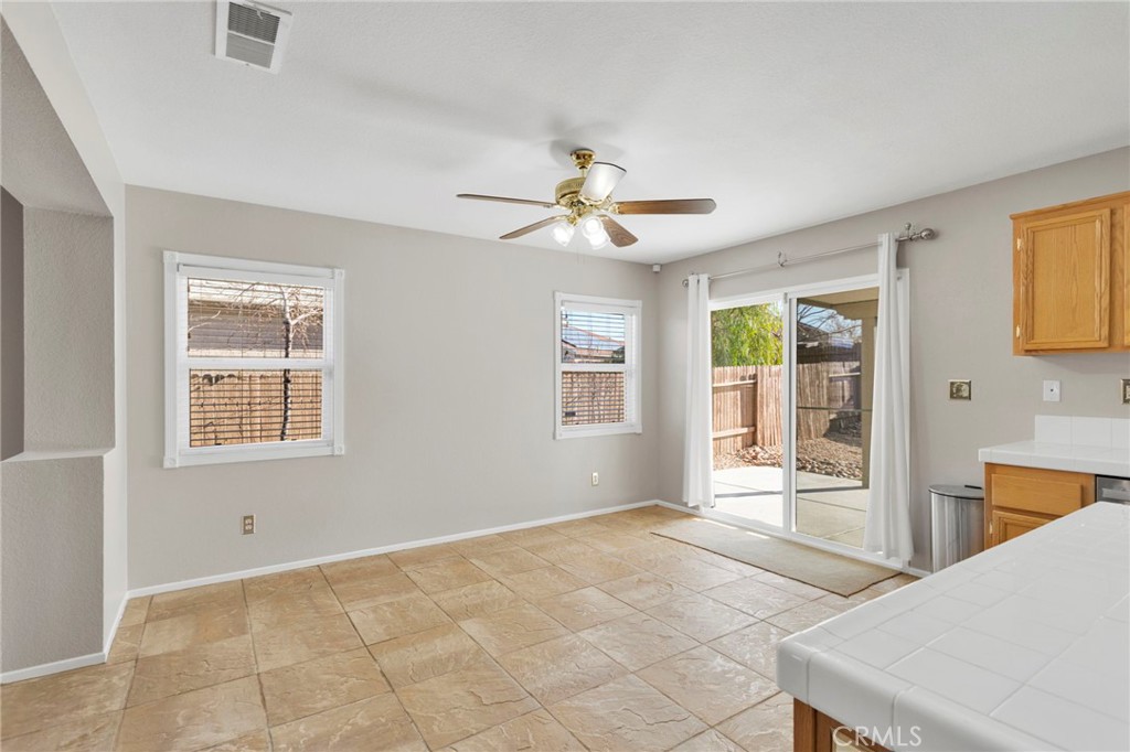 11979 Luna Road Victorville, CA 92392 - Photo 17 of 49 a view of an empty room with a window