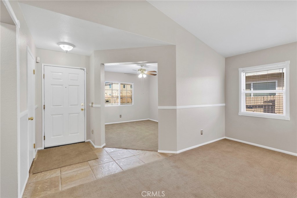 11979 Luna Road Victorville, CA 92392 - Photo 19 of 49 a view of an empty room with a window
