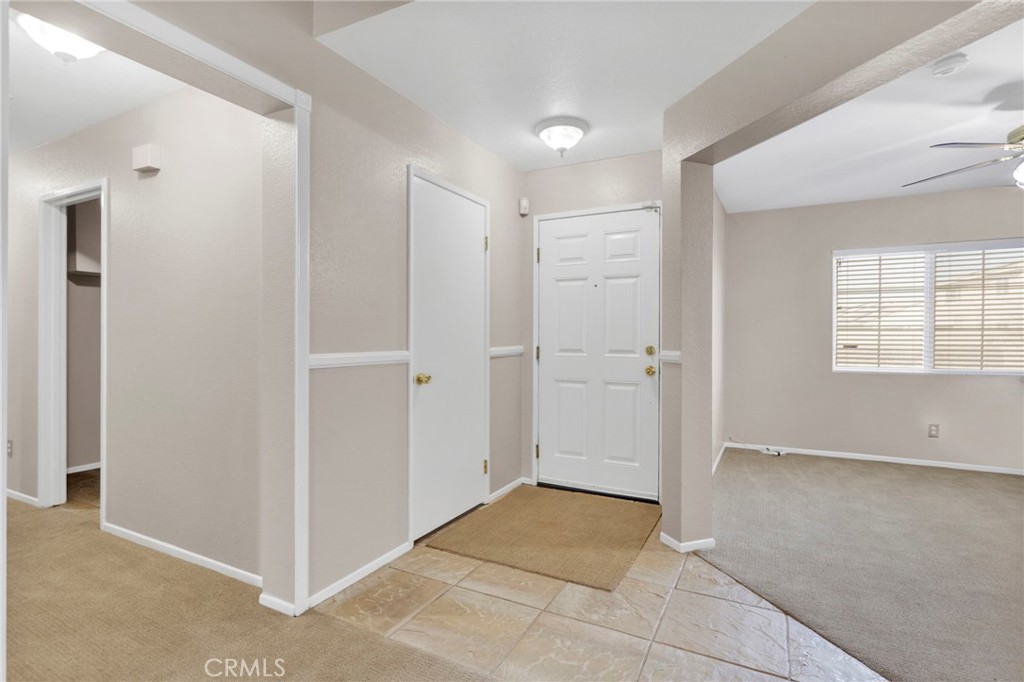 11979 Luna Road Victorville, CA 92392 - Photo 22 of 49 an empty room with windows