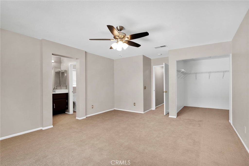 11979 Luna Road Victorville, CA 92392 - Photo 33 of 49 a view of an empty room with a ceiling fan