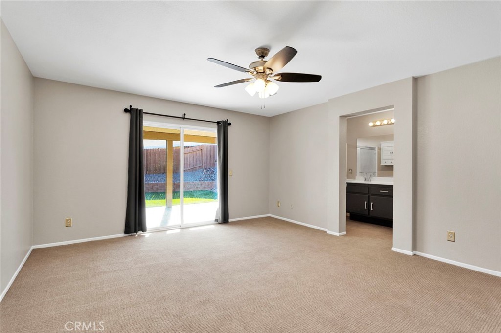 11979 Luna Road Victorville, CA 92392 - Photo 36 of 49 a view of an empty room with a window