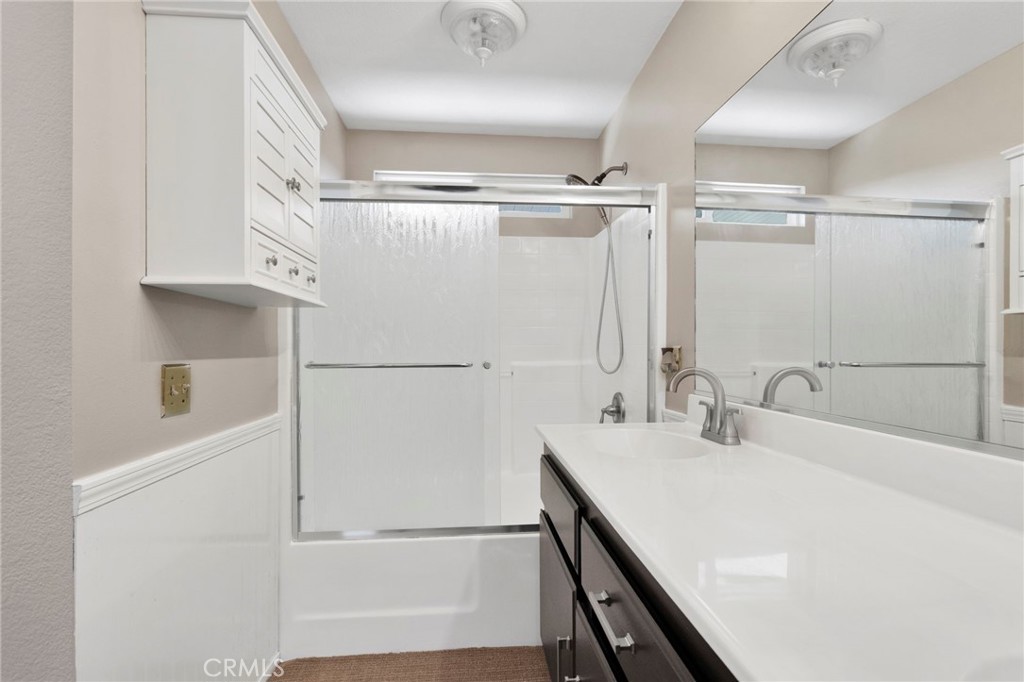11979 Luna Road Victorville, CA 92392 - Photo 38 of 49 a bathroom with a sink and a mirror