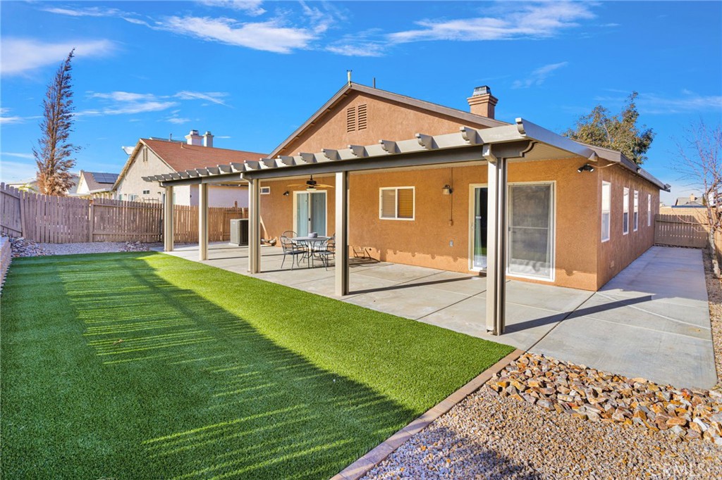 11979 Luna Road Victorville, CA 92392 - Photo 46 of 49 a front view of a house with garden