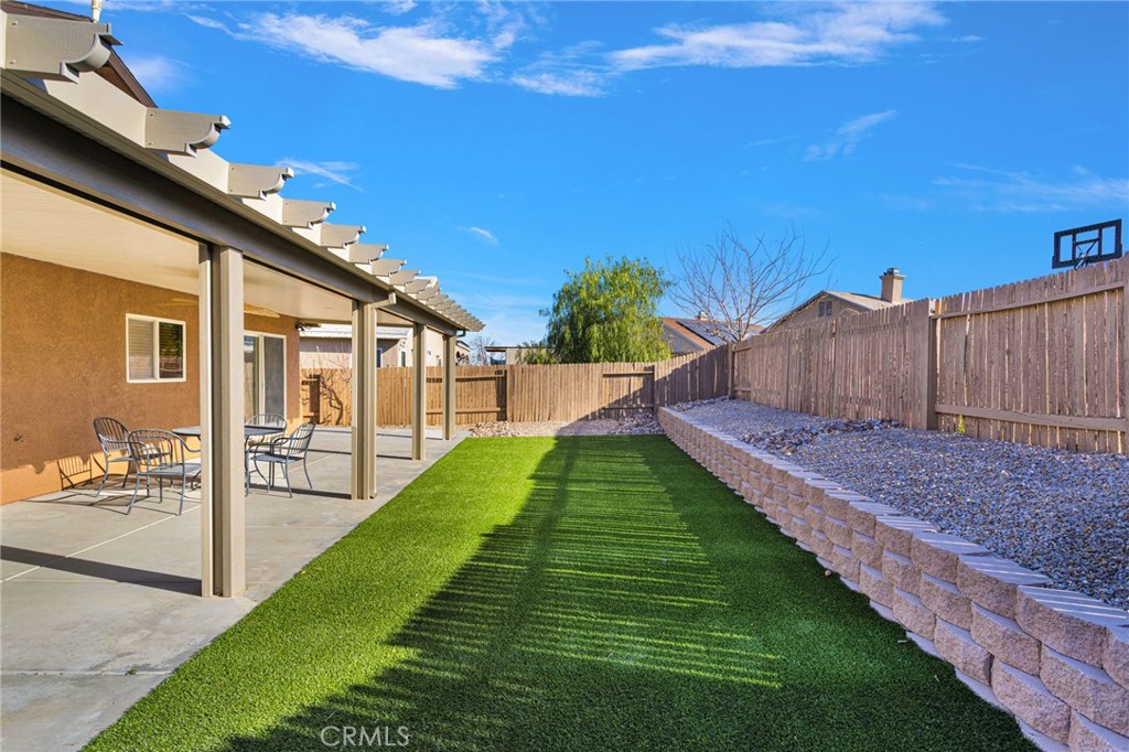 11979 Luna Road Victorville, CA 92392 - Photo 48 of 49 a view of a backyard with a garden