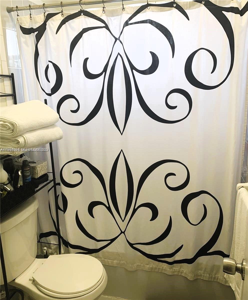 662 East 21st Street Hialeah, FL 33013 - Photo 16 of 21 a bathroom with a toilet and a sink