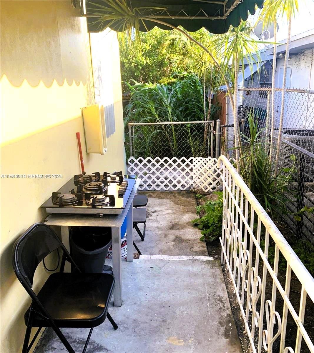 662 East 21st Street Hialeah, FL 33013 - Photo 18 of 21 a view of a chairs and table in the patio