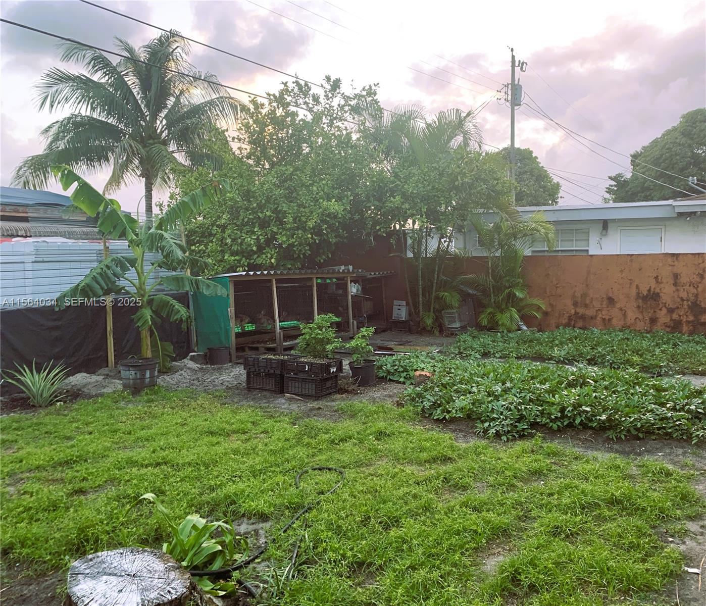 662 East 21st Street Hialeah, FL 33013 - Photo 20 of 21 a view of a chair and table in backyard of the house