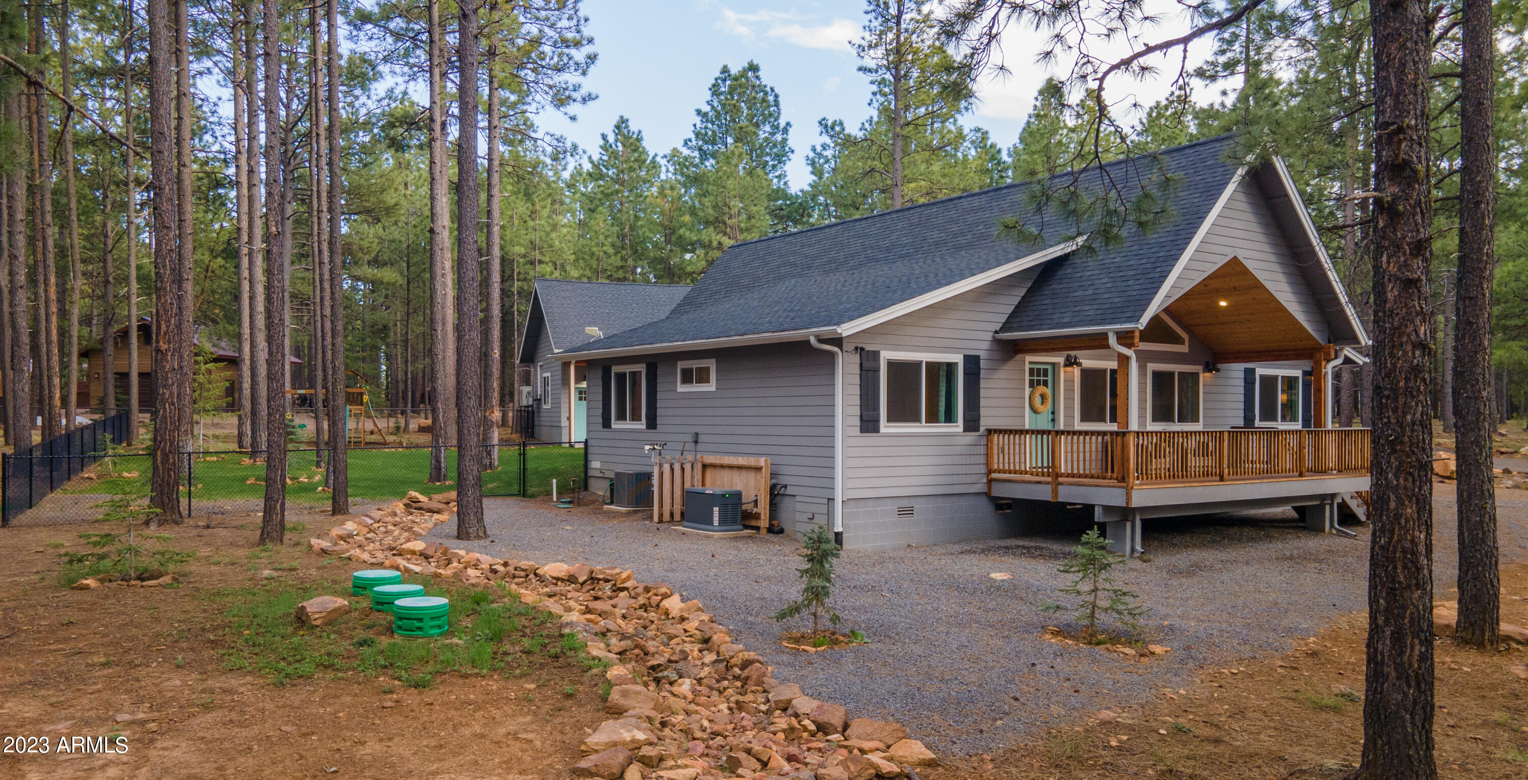 2772 Larson Loop Forest Lakes, AZ 85931 - Photo 60 of 65 a front view of a house with garden