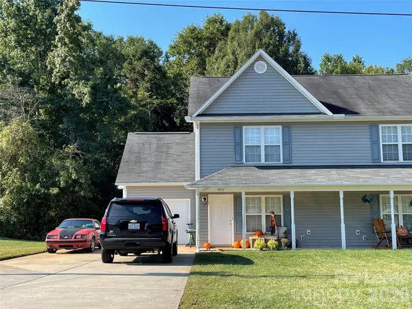 a car parked in front of a house