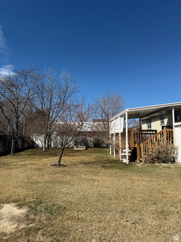 1259 West Raintree Drive Price, UT 84501 - Photo 8 of 10 View of yard with a deck