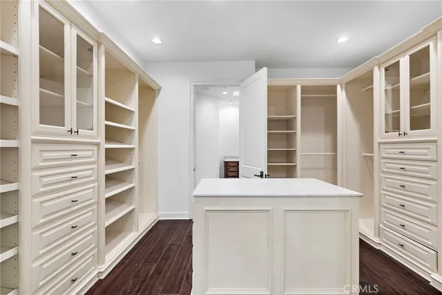 a view of a patio with table and chairs with wooden floor and fence
