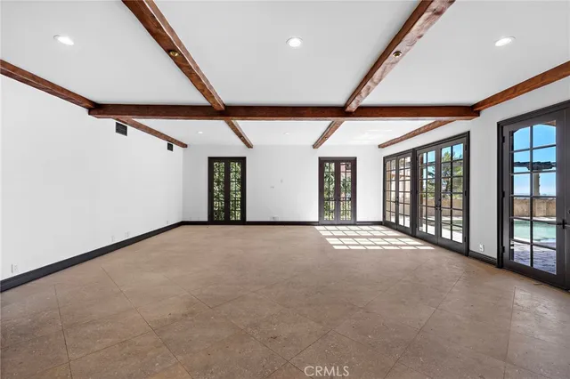 a view of a porch with a table and chairs with wooden fence