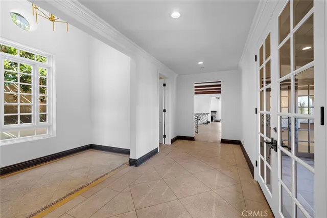 a view of a livingroom with a fireplace and window
