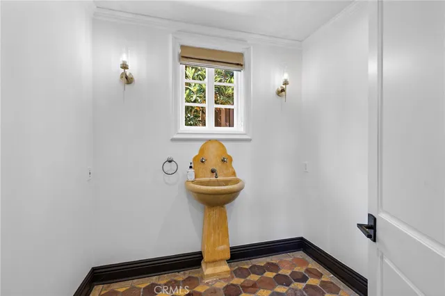 a view of empty room with fireplace and a rug