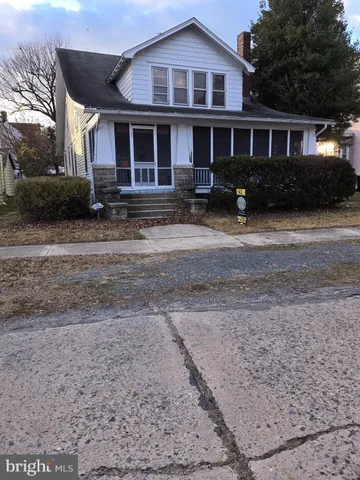 a front view of a house with yard