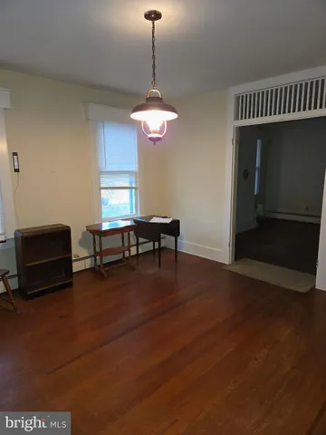 a view of a livingroom with furniture and chandelier