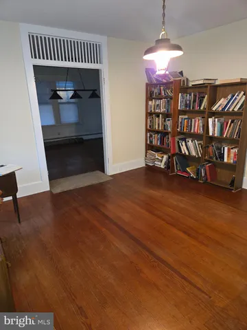 a view of hall way with furniture