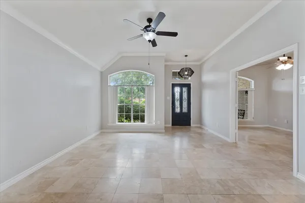 a kitchen with granite countertop a sink stainless steel appliances and white cabinets
