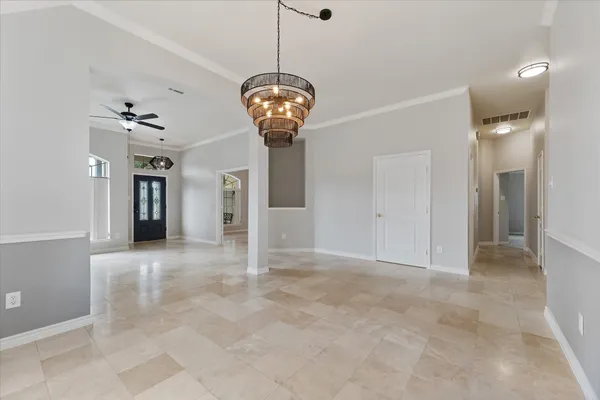 a view of a big room with closet and windows