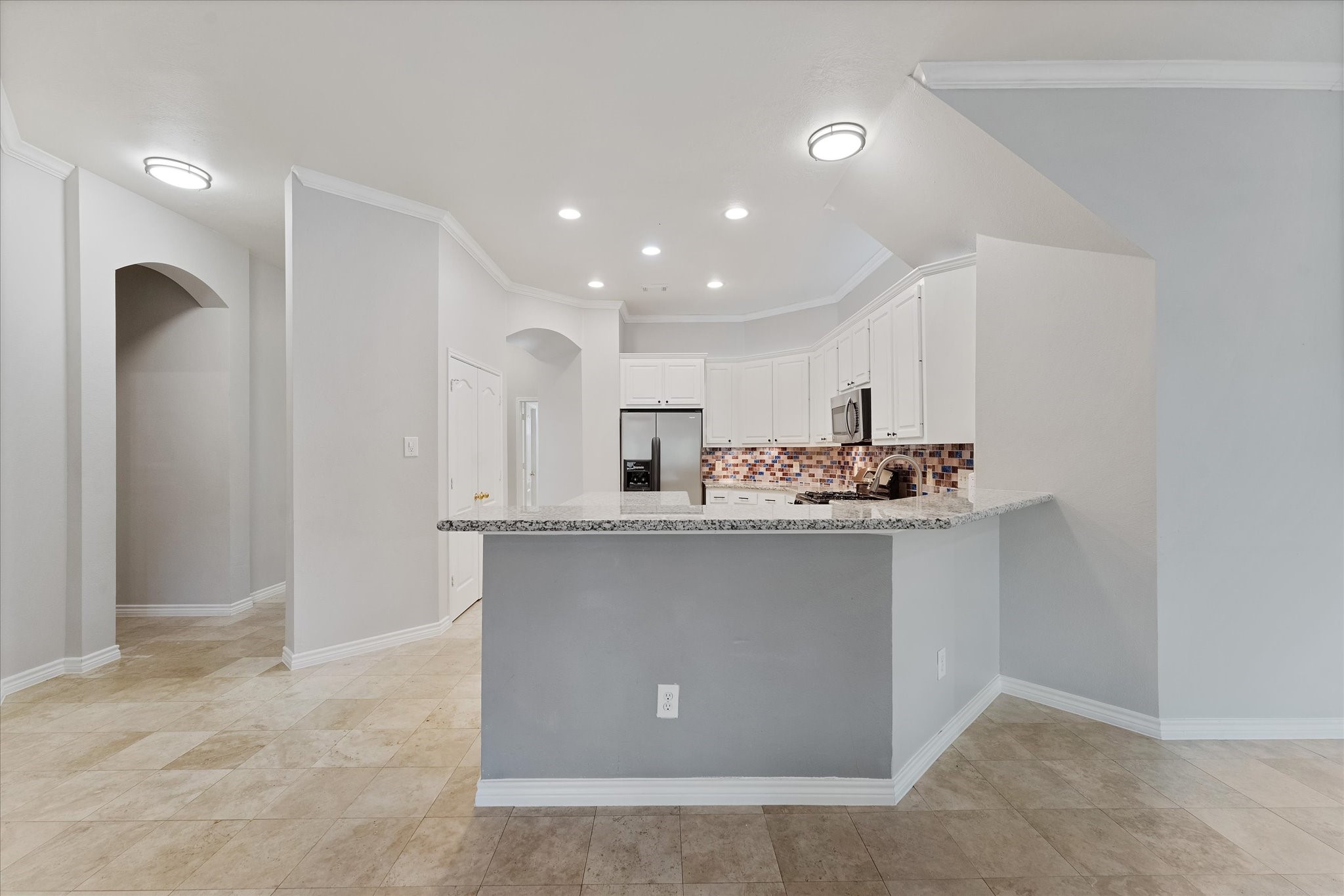 29823 Spring Terrace Drive Spring, TX 77386 - Photo 16 of 49 a kitchen with stainless steel appliances granite countertop a sink a stove and a refrigerator