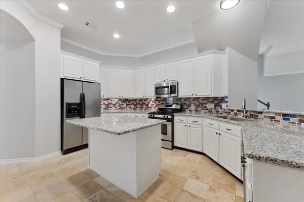 a bathroom with a sink double vanity and a mirror